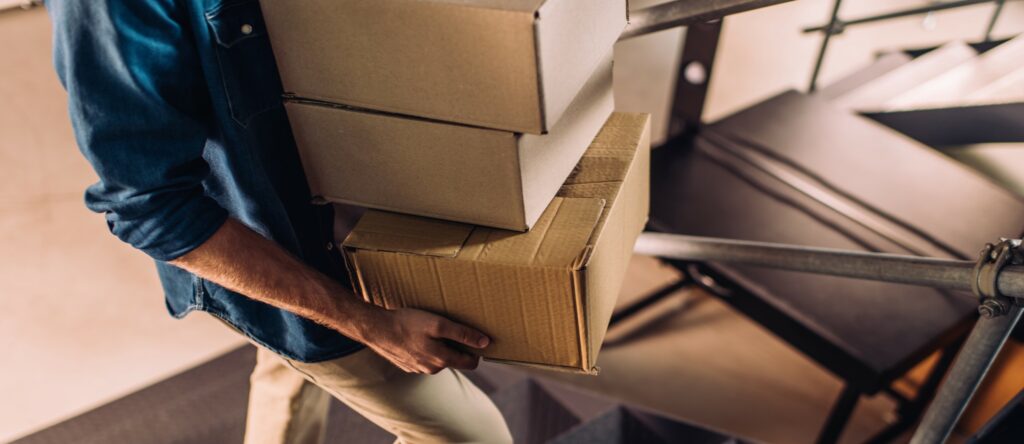 Man Climbing Stairs with Packages